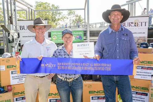 Best Pen of Droughtmaster of Droughtmaster Infused Steers Pictured: Glenn Henrickson – Rural Bank; Colleen Fricke from Vale View Droughtmasters with Lance Whitaker. | Burnett Livestock & Realty