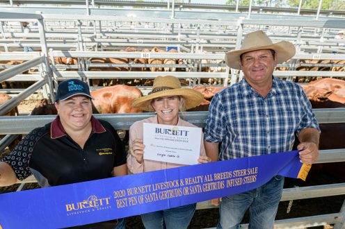 Kelly Bagnall from Bendigo Bank with Megan & Rodney Dingle from Dingle Cattle Co with their class winning Santa Gertrudis steers. | Burnett Livestock & Realty